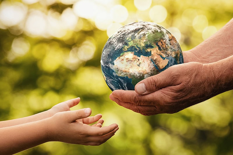 Understanding Geothermal Heat Pump Costs in North St. Paul. A set of hands holding a globe.